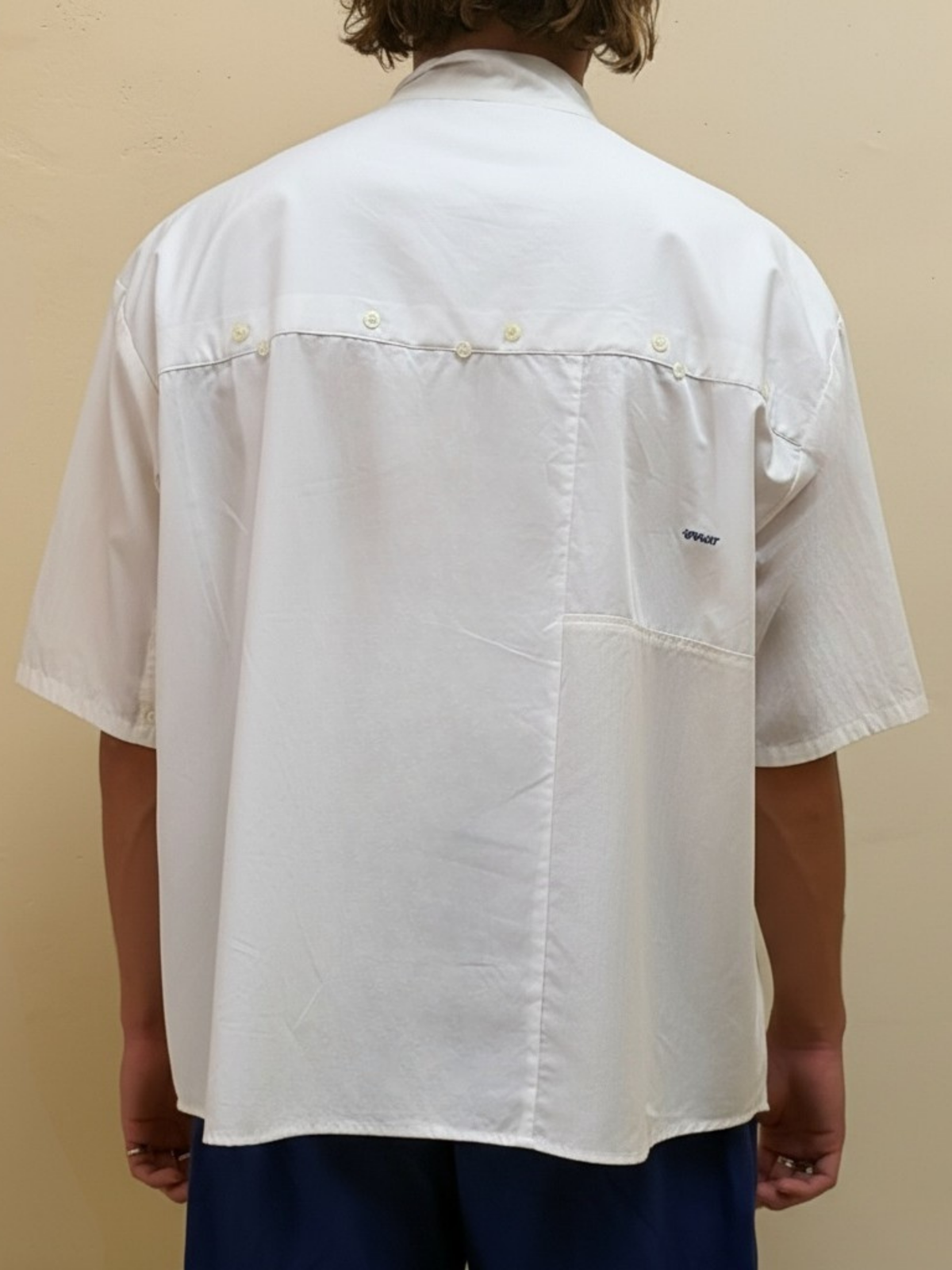 The Blank Canvas One white upcycled patchwork shirt by Kazuki, back view with button details