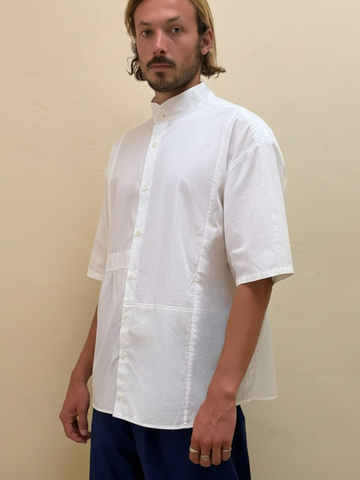 The Blank Canvas One white upcycled patchwork shirt by Kazuki, three-quarter view