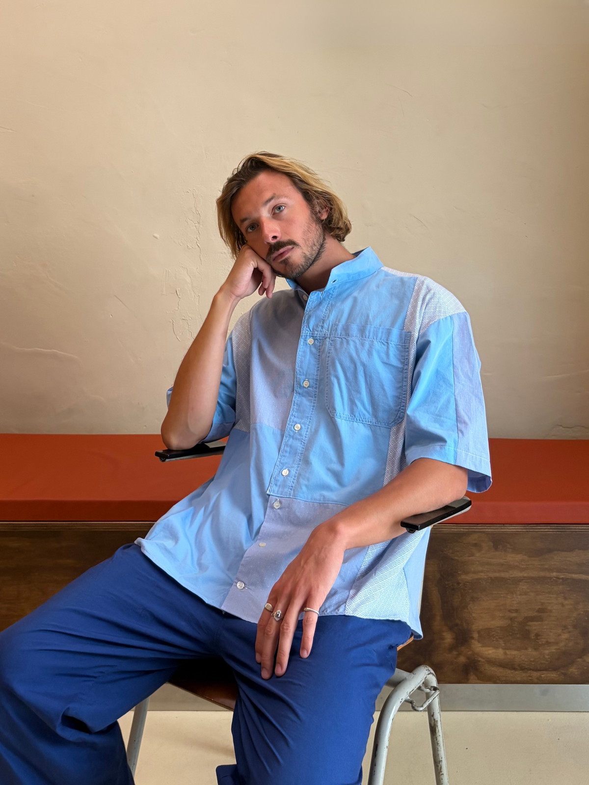 Model wearing The Blue Mosaic One blue upcycled patchwork shirt by Kazuki