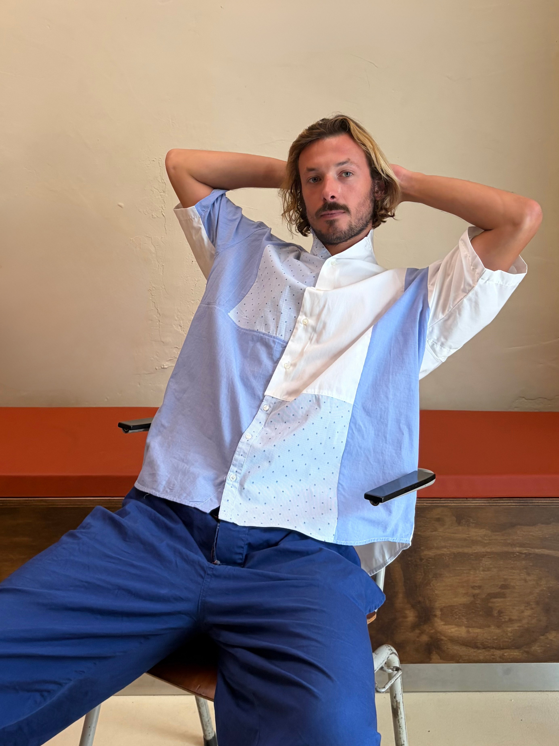 Model wearing The Soft Sky One blue and white upcycled patchwork shirt by Kazuki