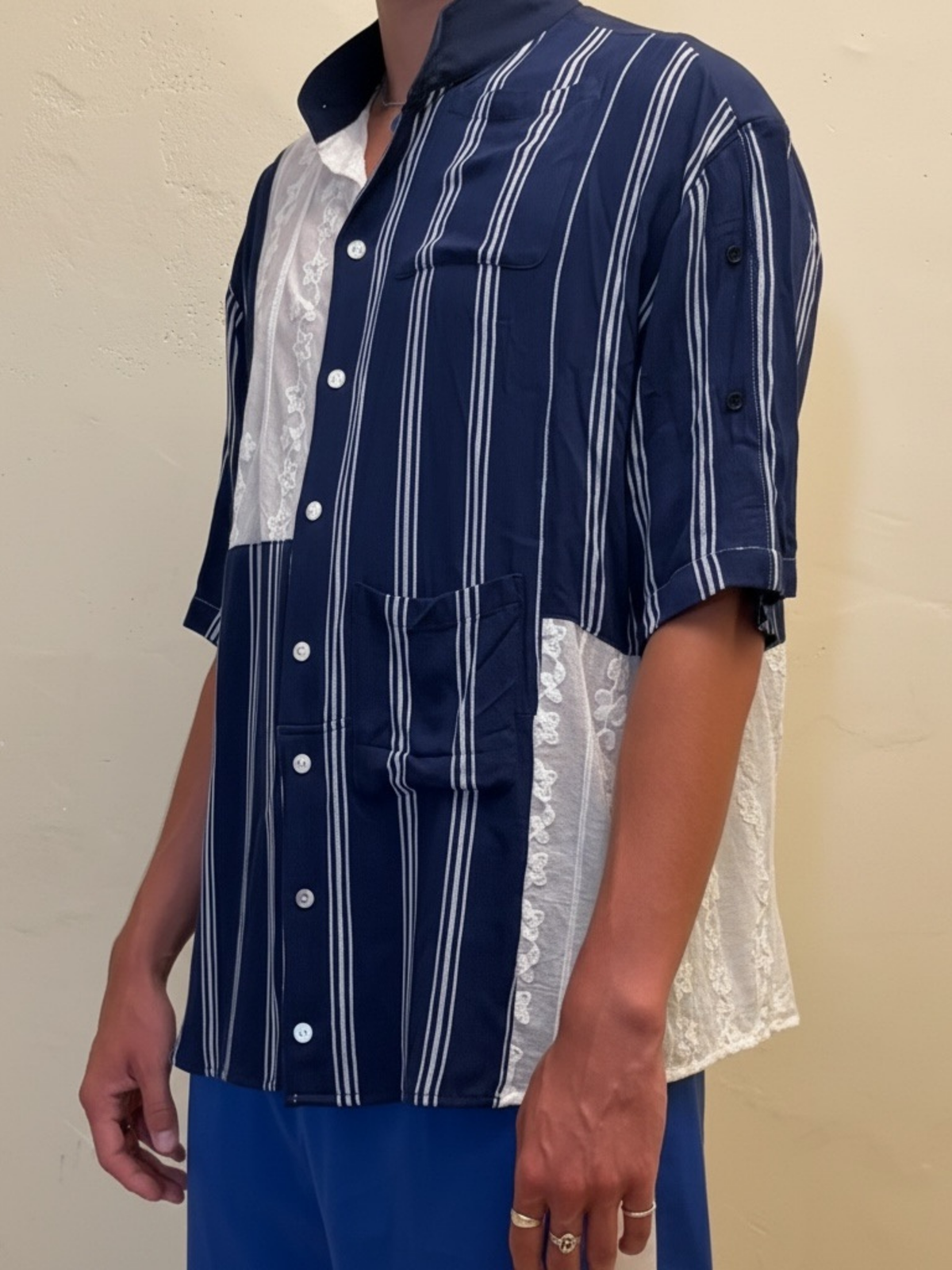 The Midnight Lace One navy striped upcycled shirt with lace panels, three quarter view