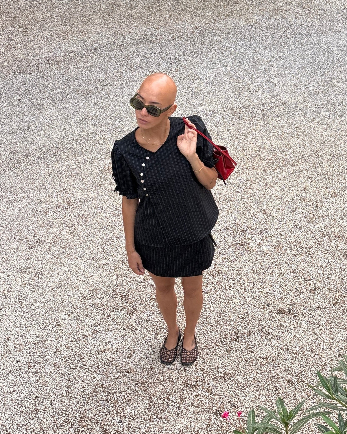 Pinstripe Dolly deadstock wool blouse by Kazuki styled with a pinstripe wrap skirt and red bag