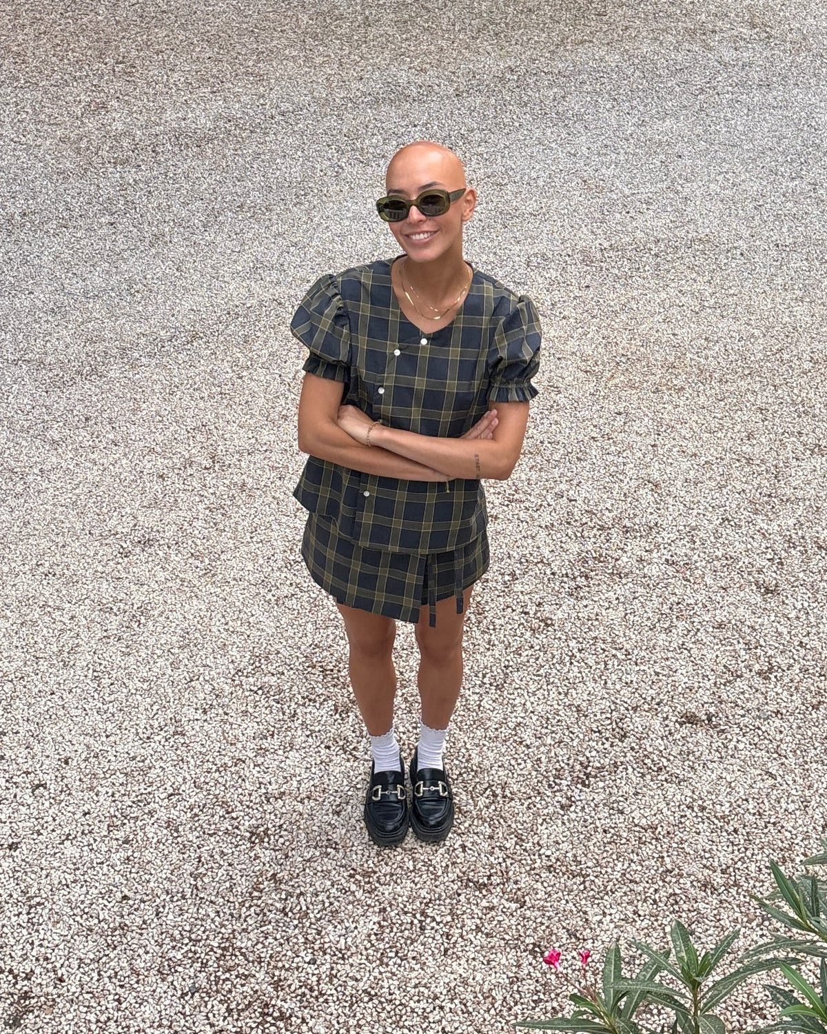 Tartan wrap mini skirt and Tartan Dolly blouse by Kazuki worn as a matching grey and olive tartan set with loafers